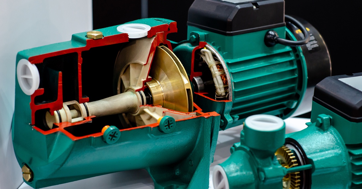 A black and green vacuum pump. A portion of the outer housing has been cut away to show the pump's interior.